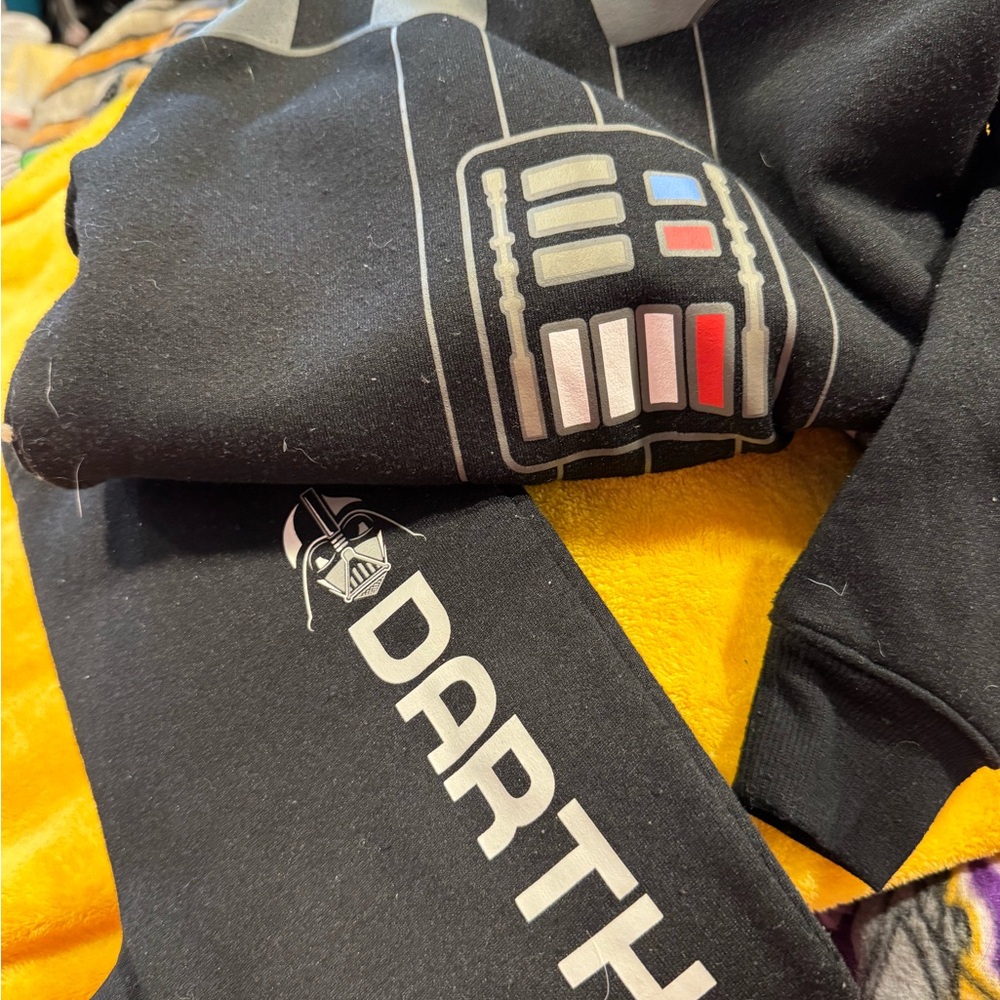 Darth Vader sweatshirt and pants and a Minecraft sweatshirt and pants and a zipp
